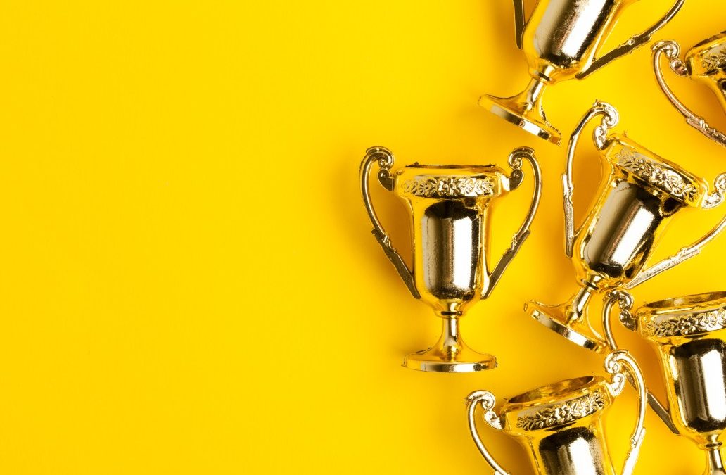 decorative image of trophies on a yellow background to showcase Jefferson Park being named one of the best nursing homes in tennessee for the second year.