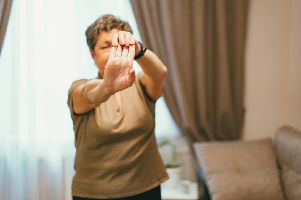 elderly woman exercising by doing some yoga a great exercise for seniors